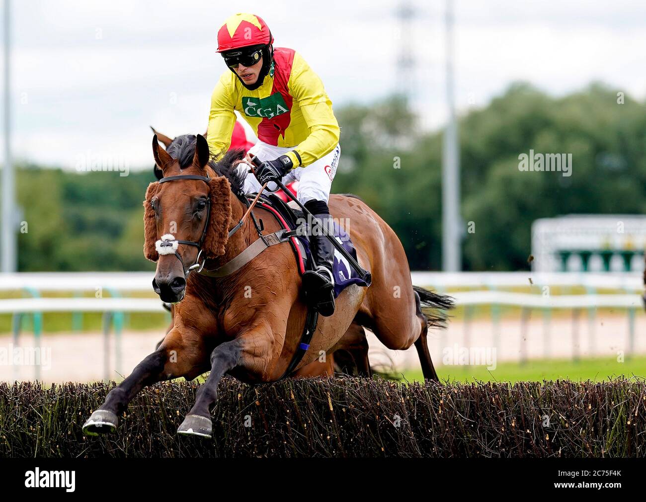 Rhythm Is A Dancer ridden by jockey Harry Cobden clears the last to win the Brand Activation At signsolutions.org Handicap Hurdle at Southwell Racecourse. Stock Photo