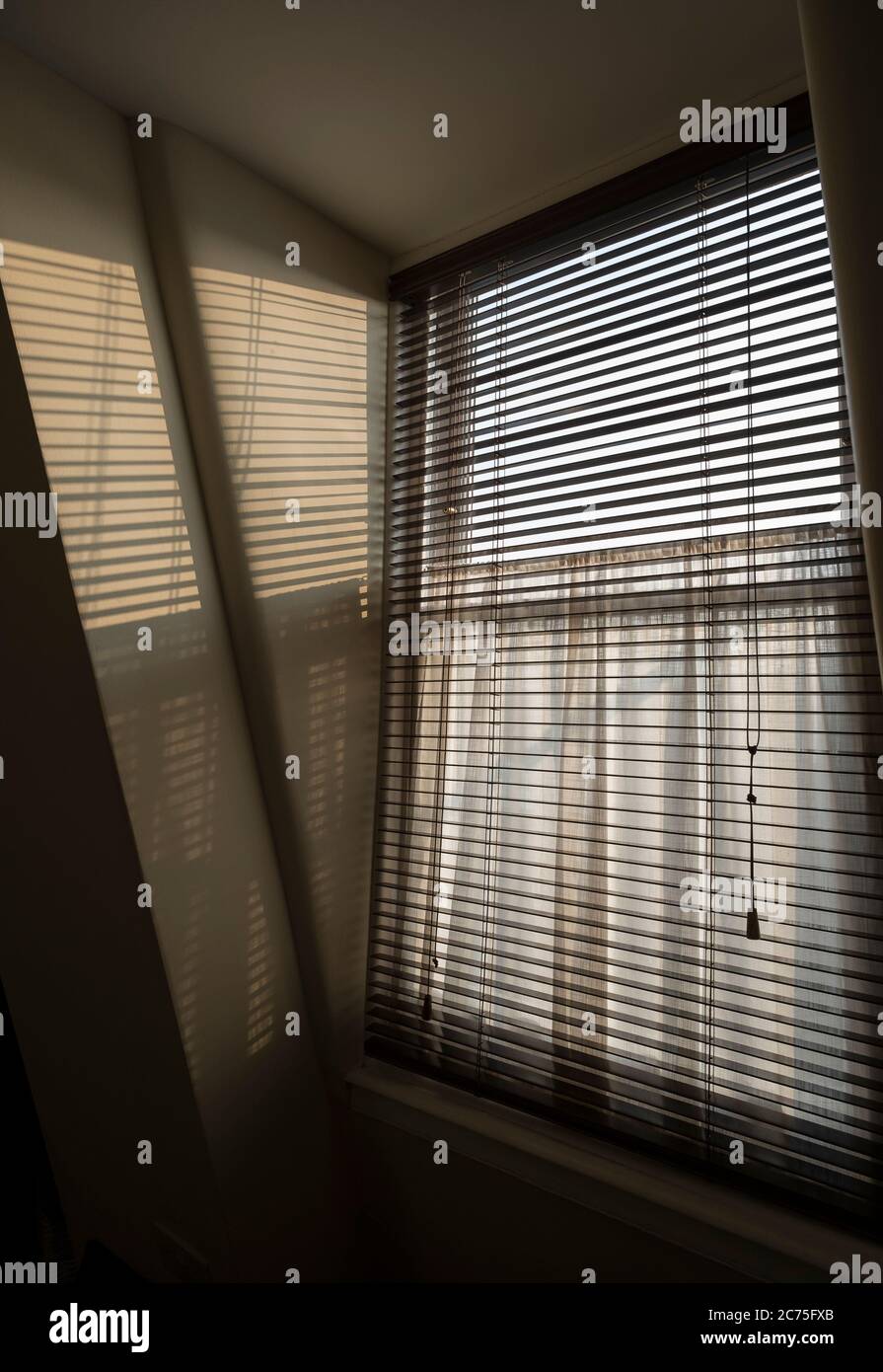 Shadows from window blind Stock Photo