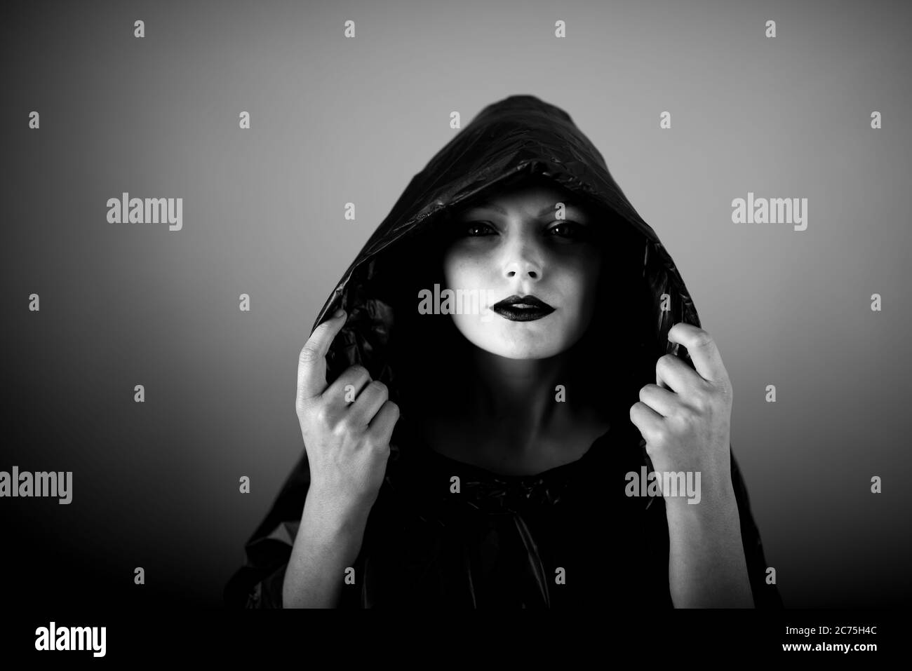 Lady in raincoat Black and White Stock Photos & Images - Alamy