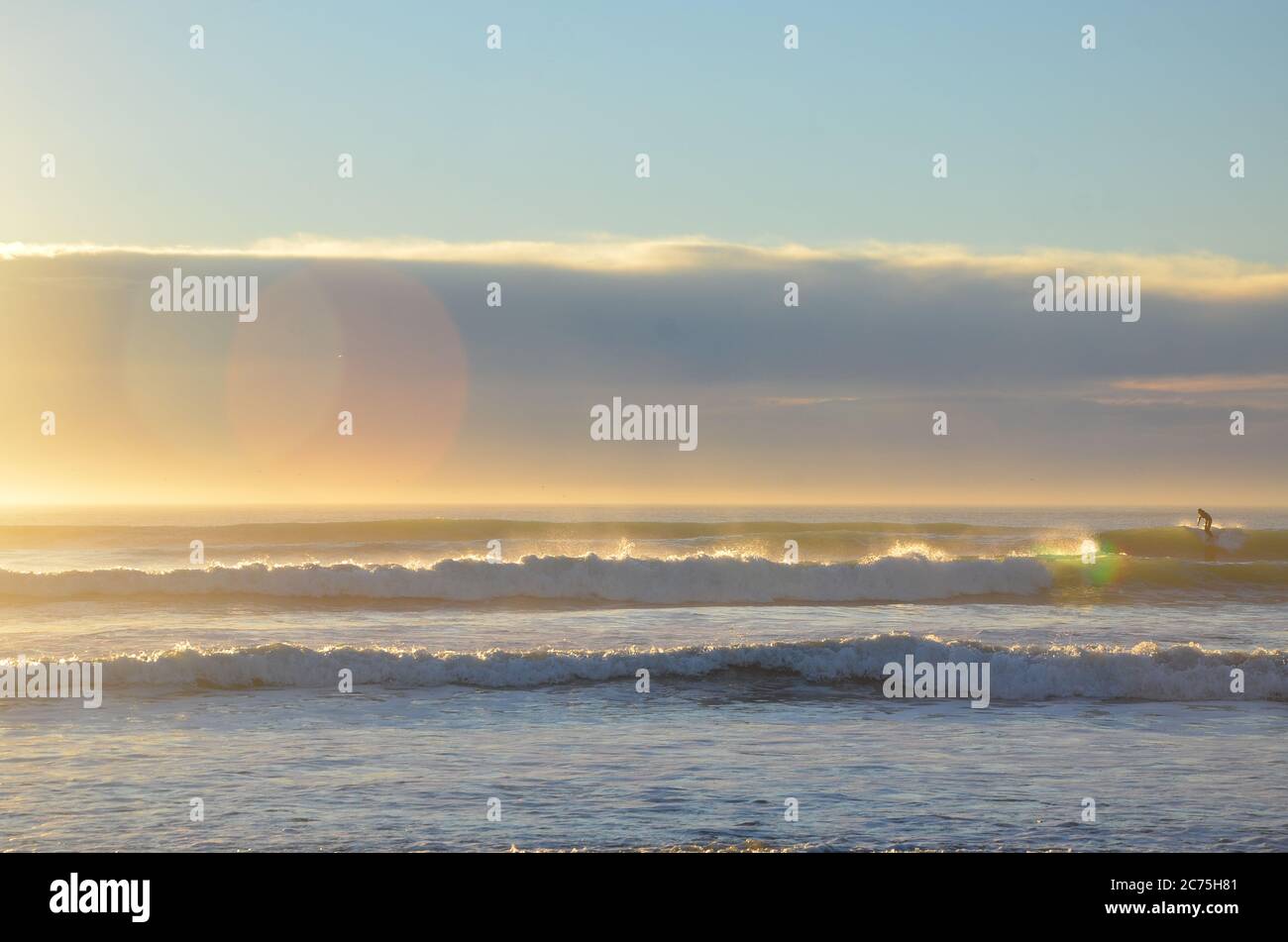 A surfer surfing at the New Brighton Beach. It's a best spot to visit