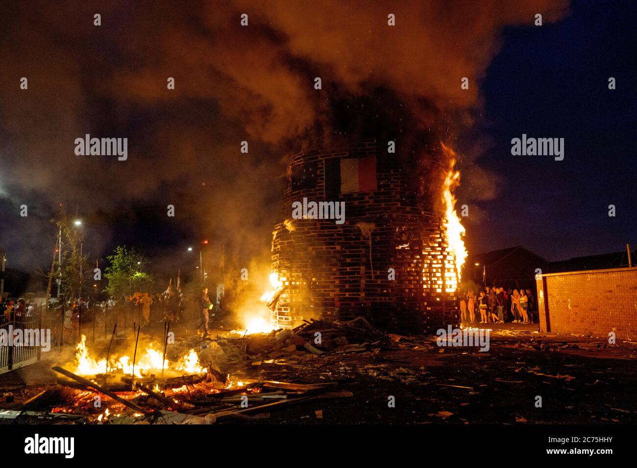 Eleventh night bonfire celebrations take place beside the Dr Pitt Memorial Park off the lower Newtownards Road in Belfast. Stock Photo