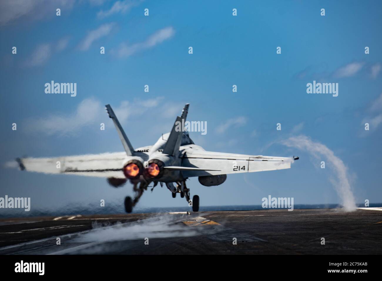 A U.S. Navy F/A-18E Super Hornet fighter aircraft, from the Royal Maces of Strike Fighter Squadron 27, launches from the flight deck of the Nimitz-class aircraft carrier USS Ronald Reagan during operations July 13, 2020 in the Indian Ocean. Stock Photo