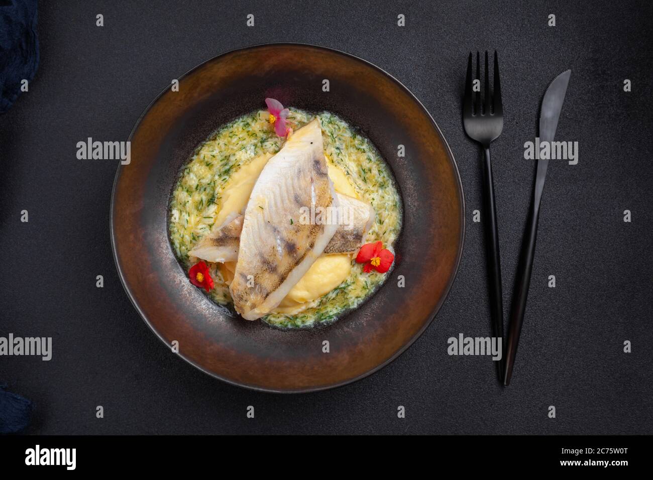 Steamed hot fish dish pike perch with Polish sauce Stock Photo - Alamy