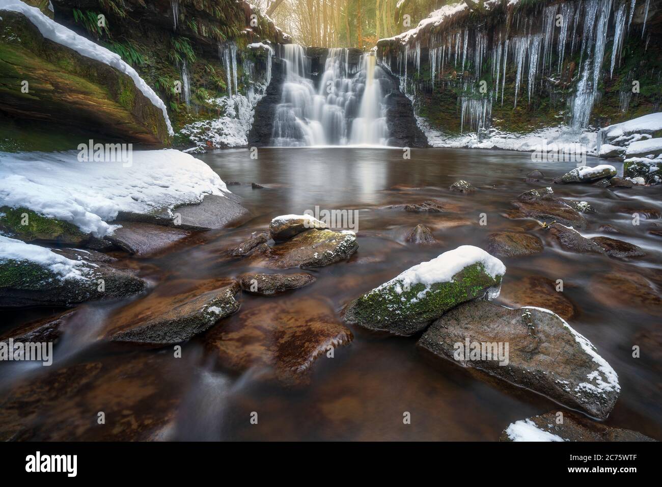 Goit Stock Falls in Cullingworth during the 'Beast from the East', with snow on the rocks and huge icicles formed by the freezing conditions. Stock Photo