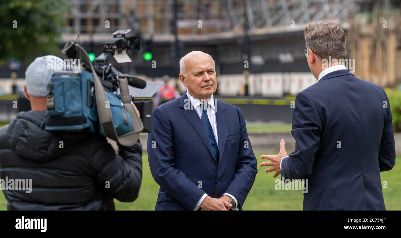 London, UK. 14th July, 2020. MP's in Westminster: Iain Duncan Smith Conservative MP for Chingford and Woodford and former leader of the Conservative party. He is pictured on College Green Westminster giving an interview on the Huawei UK 5G ban Credit: Ian Davidson/Alamy Live News Stock Photo