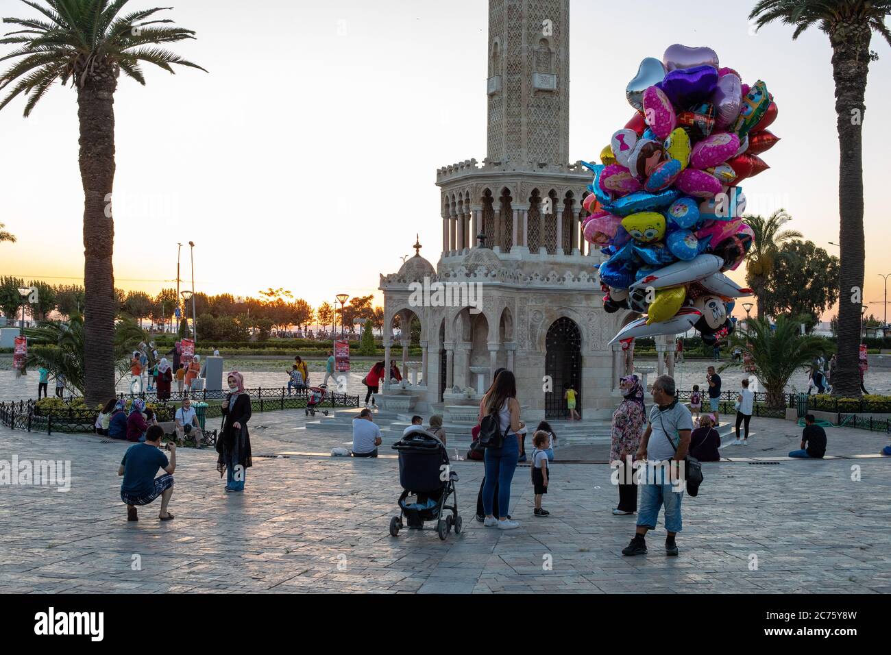 IZMIR, TURKEY,JULY 12 ,2020: People who spend time at Konak beach and  around the clock tower at the end of the summer day Stock Photo - Alamy