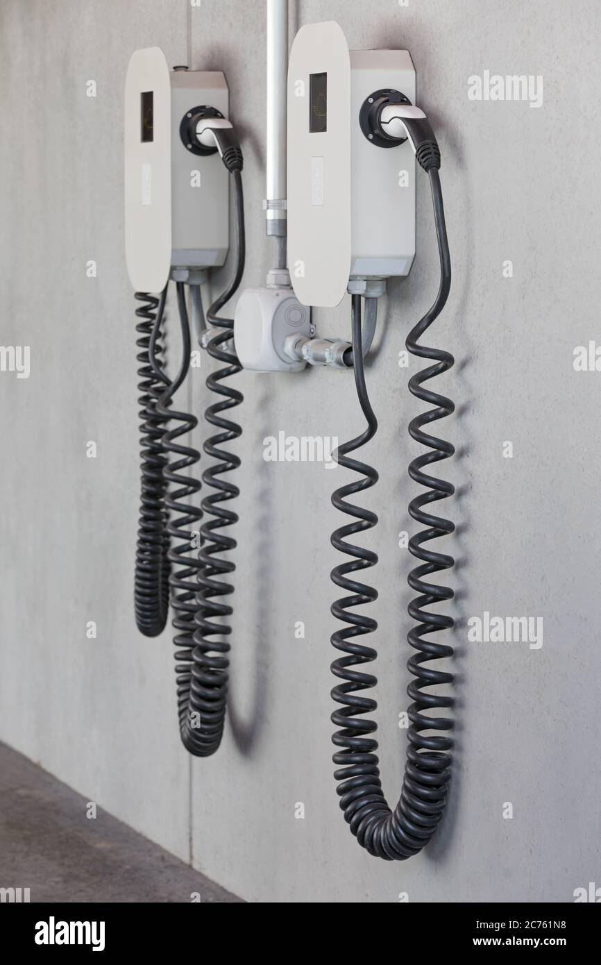two car charger on concrete wall Stock Photo