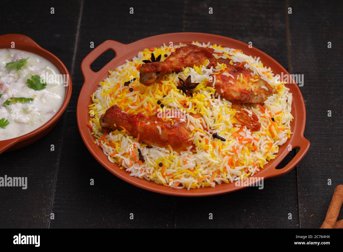 Chicken biryani , Tandoori chicken with basmathi rice and raita as side