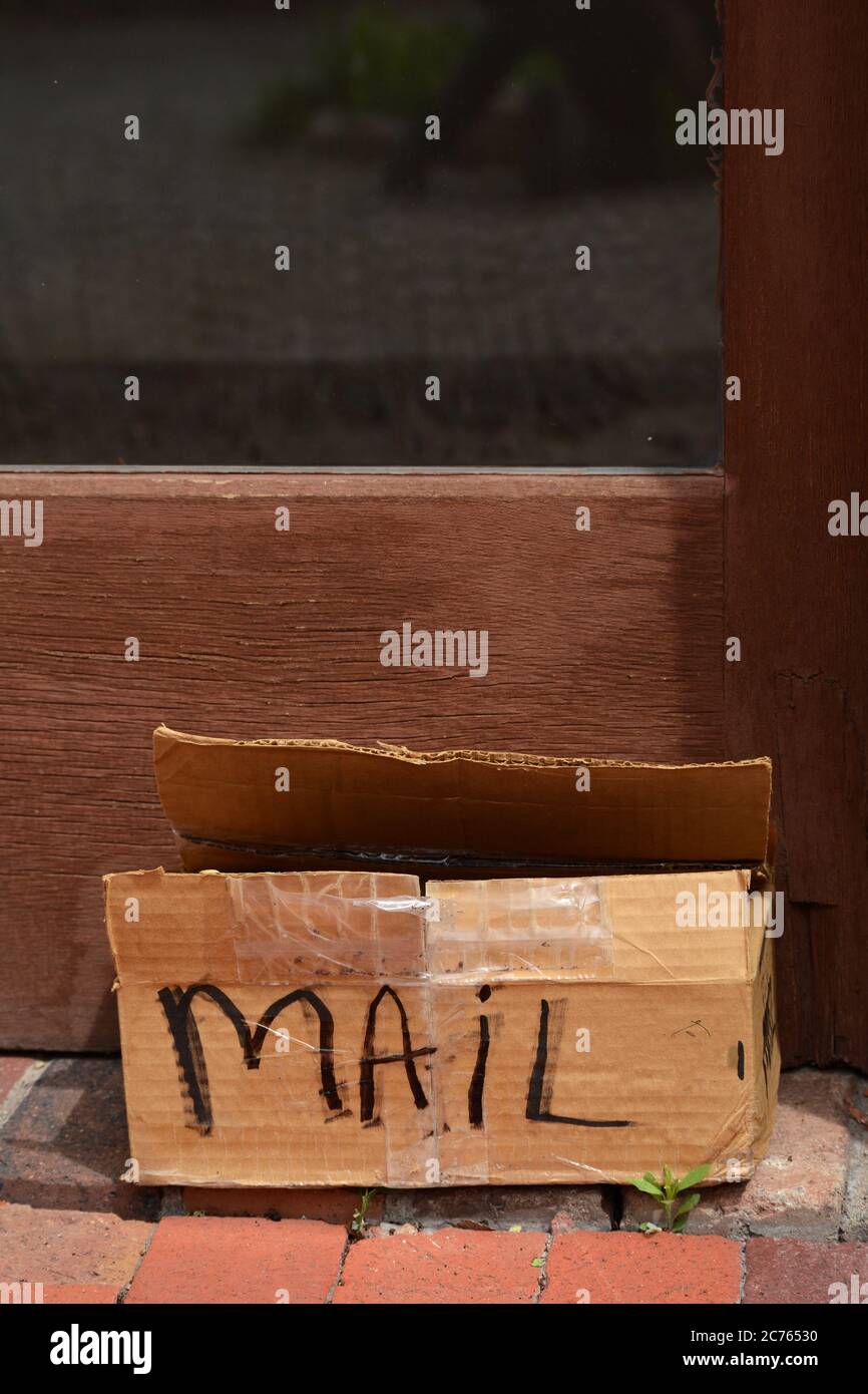 A temporary mailbox made from a cardboard box outside a retail shop in Santa Fe, New Mexico. Stock Photo