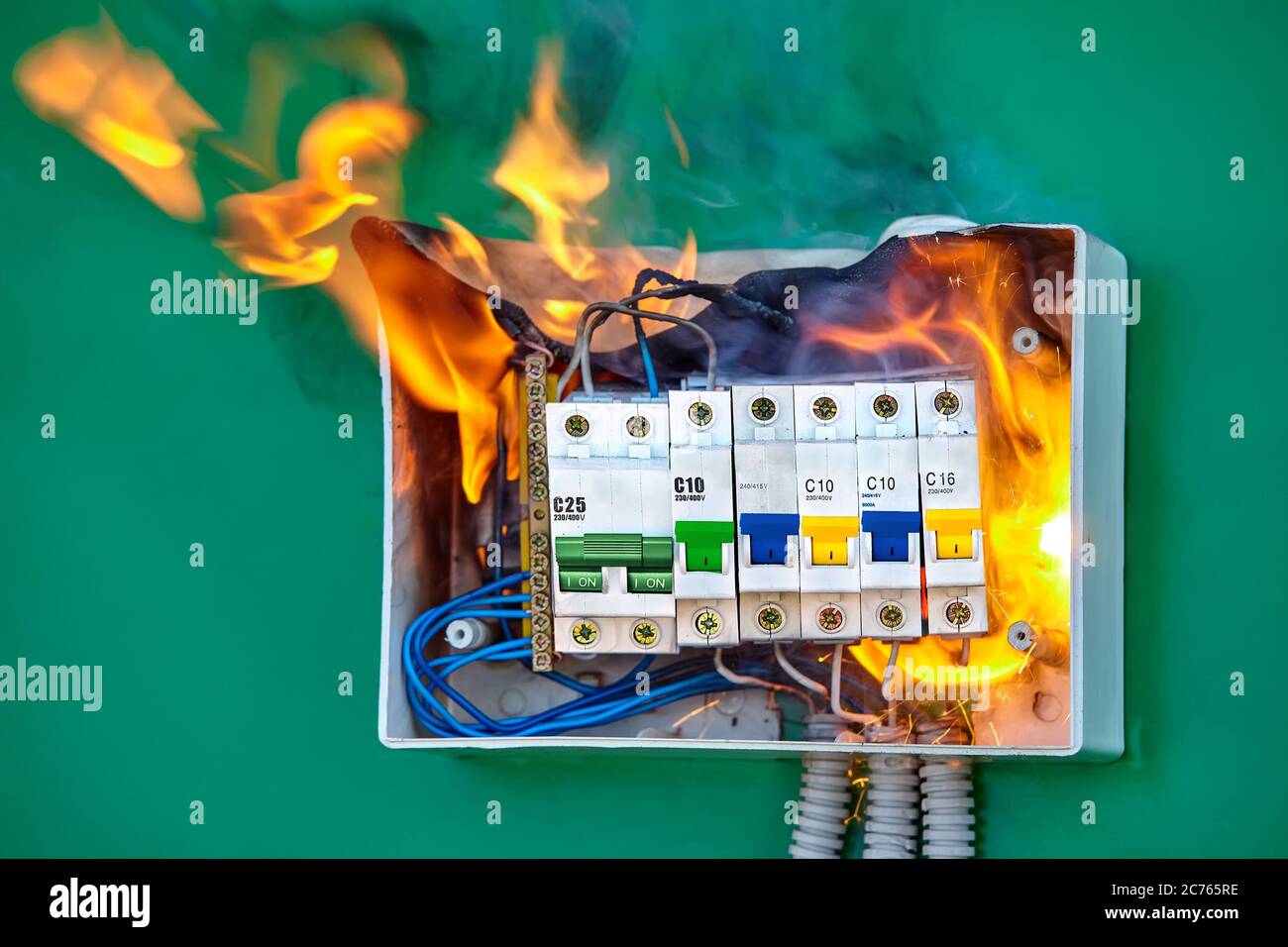 A short circuit caused an electric fire. Faulty wires led to overload of the electrical network and ignition. The distribution board in the house igni Stock Photo