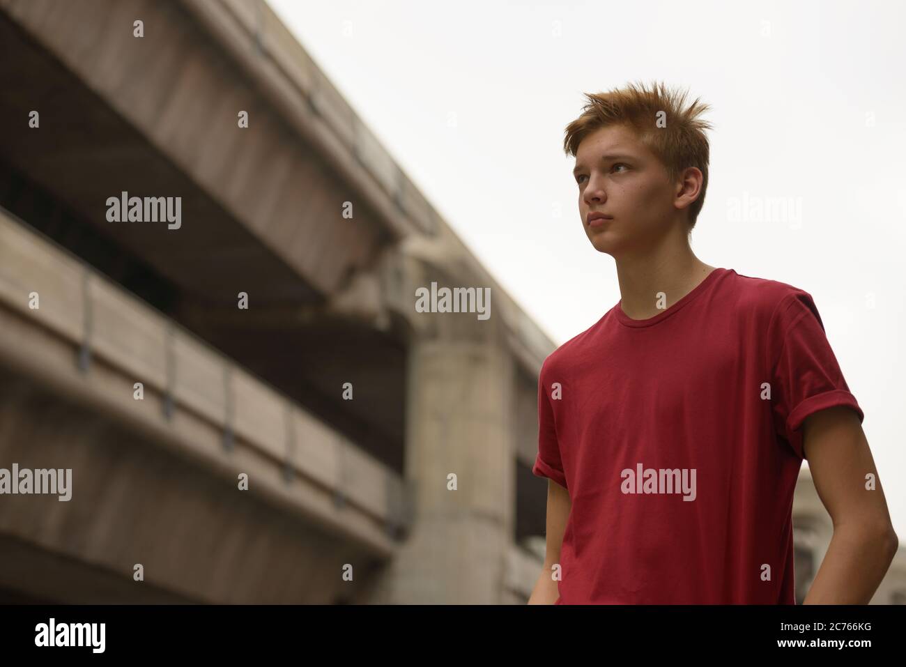 Young handsome teenage boy in the city outdoors Stock Photo - Alamy