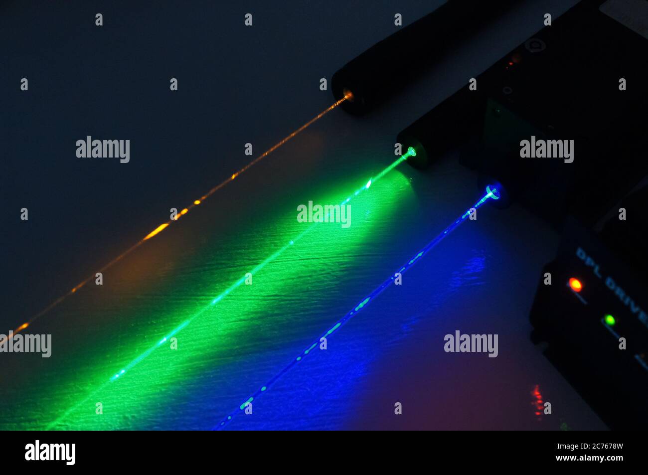 laser beams of multiple colours in a line parallel to each other, science, scientific, lab, test, environment, DPSS, 589, 473, 532, nm, nanometre Stock Photo