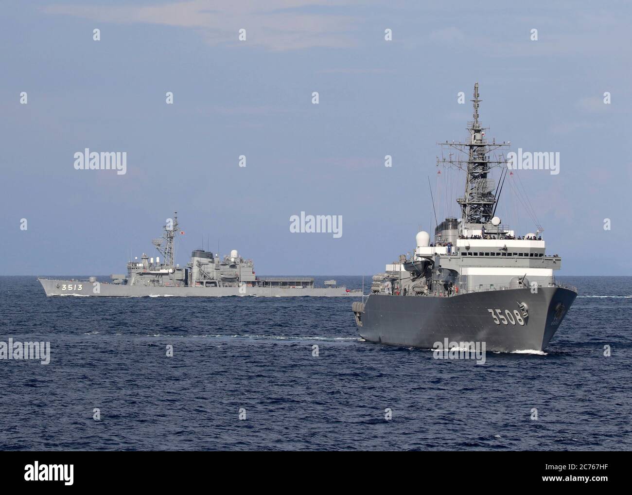 The Japan Maritime Self-Defense Kashima class cadet training ship JS Kashima, right, and Force Hatsuyuki-class destroyer JS Shimayuki during a joint patrol with the U.S. Navy in International Waters May 9, 2020 in the South China Sea. Stock Photo