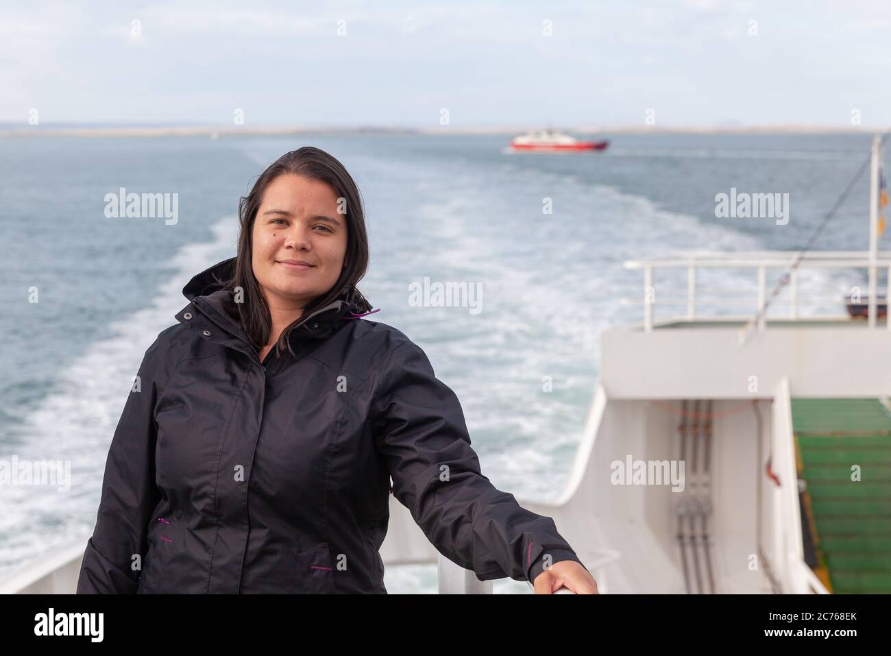 Woman in ferryboat crossing Strait of Magellan - Tierra del Fuego - Chile Stock Photo