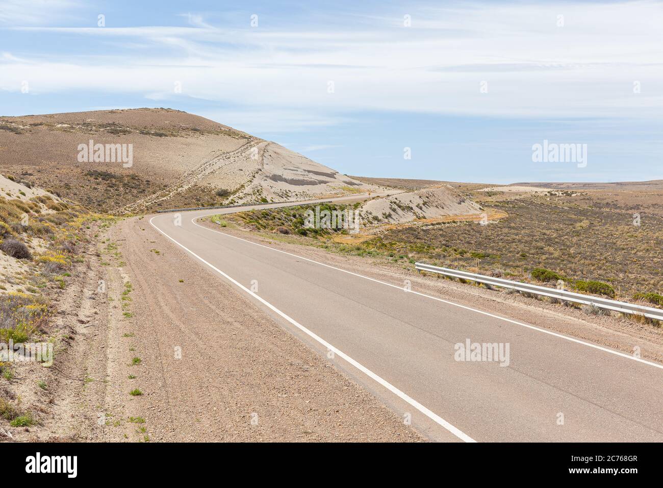 Asphalt road in the desert.  Road 3 through the Argentine Pampa - Santa Cruz province Stock Photo