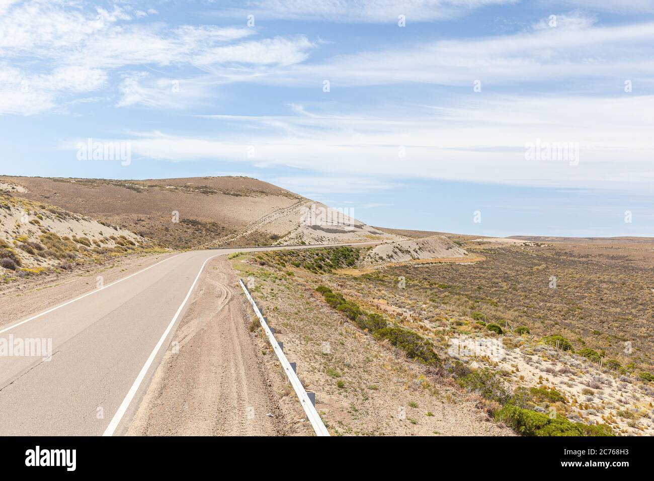 Asphalt road in the desert.  Road 3 (Ruta 3) through the Argentinean pampa - Santa Cruz province Stock Photo