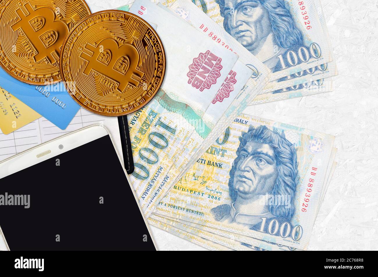 1000 Hungarian forint bills and golden bitcoins. Cryptocurrency investment  concept. Crypto mining or trading transactions Stock Photo - Alamy