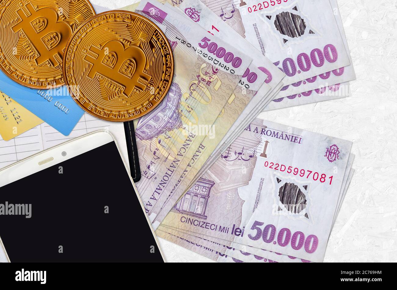 50000 Romanian leu bills and golden bitcoins. Cryptocurrency investment  concept. Crypto mining or trading transactions Stock Photo - Alamy