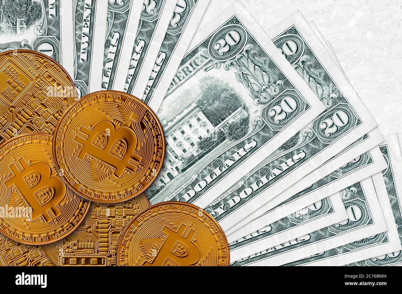 20 US dollars bills and golden bitcoins. Cryptocurrency investment concept.  Crypto mining or trading transactions Stock Photo - Alamy