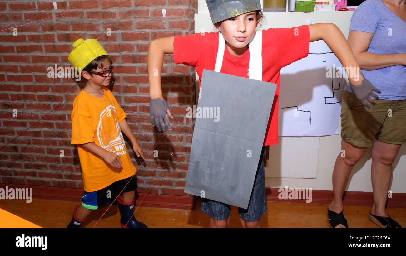 Day Camp. Brooklyn, NY. Children play acting with self-made costumes. Stock Photo