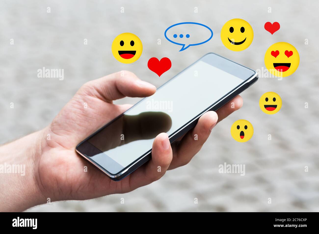 Man using his Mobile Phone outdoor, close up. Stock Photo