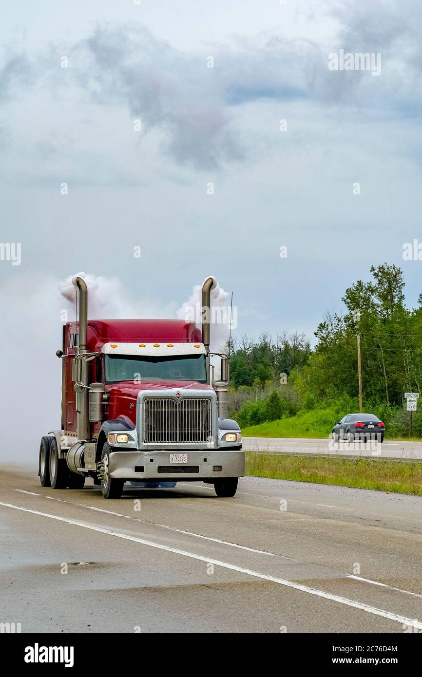 Truck belching excessive exhaust smoke, Alberta, Canada Stock Photo