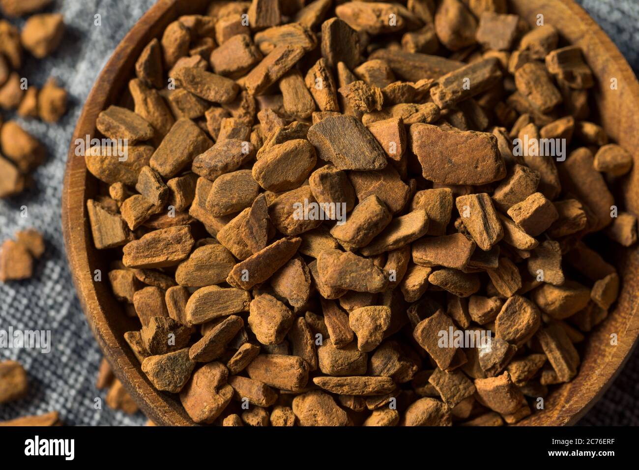 Raw Organic Cassia Cinnamon Chips in a Bowl Stock Photo