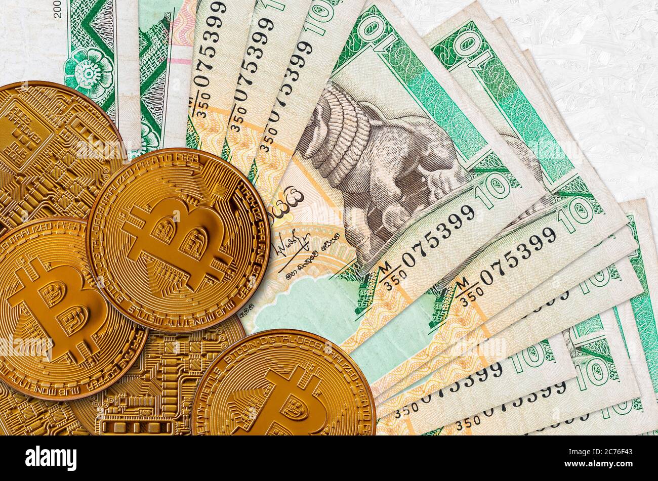 10 Sri Lankan rupees bills and golden bitcoins. Cryptocurrency investment  concept. Crypto mining or trading transactions Stock Photo - Alamy