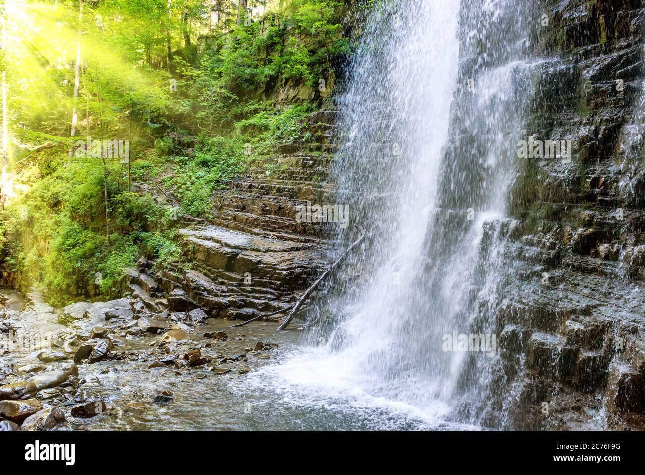 High waterfall in mountain forest hi-res stock photography and images ...