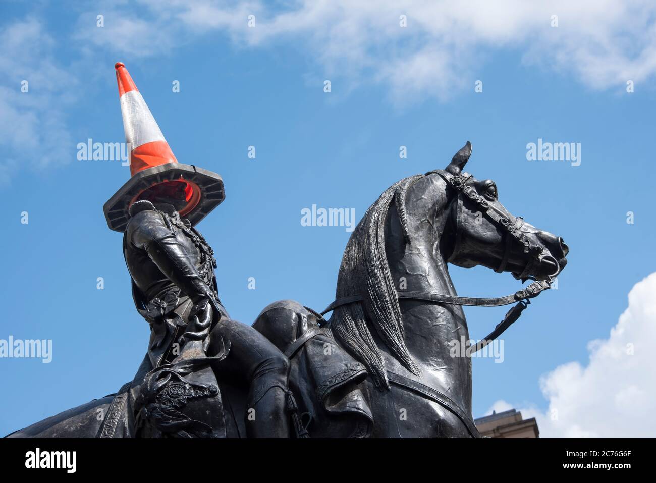 Equestrian statue of the Duke of Wellington adorned with traffic cone