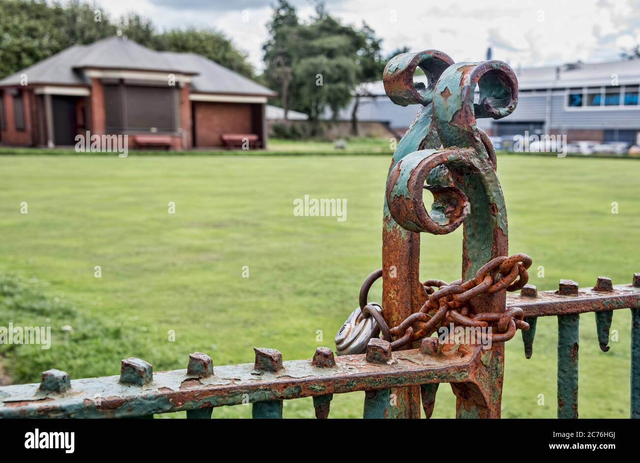 Rusting lock on derelict Bowling Green in Lister Street, central Glasgow, Scotland. Stock Photo