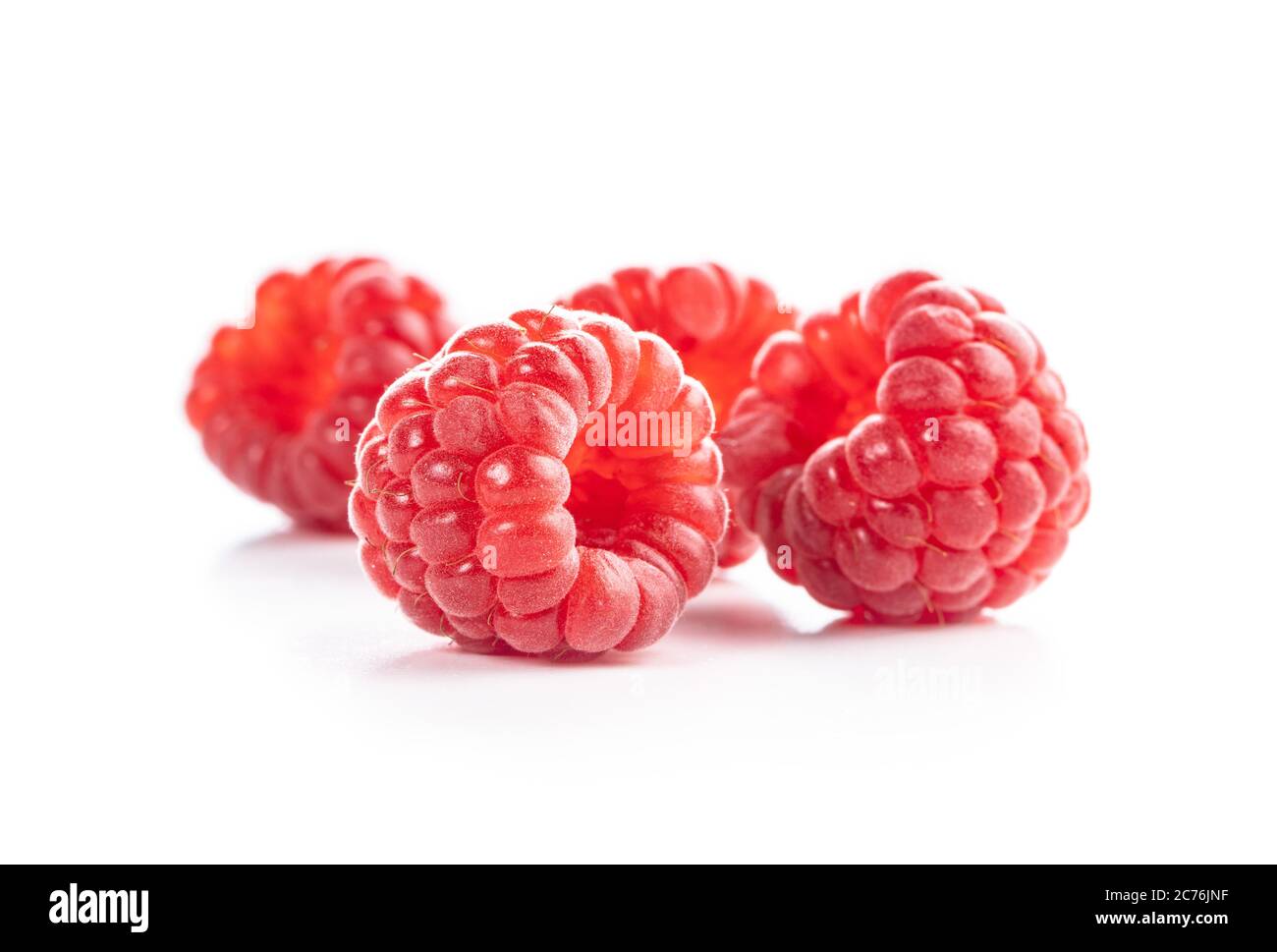 Ripe red raspberries isolated on white background. Stock Photo