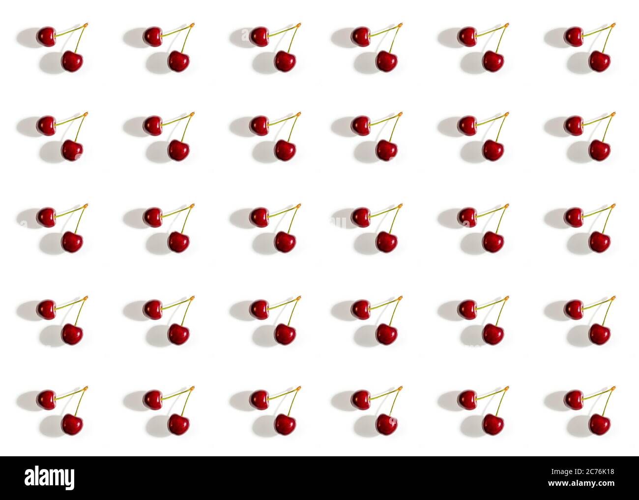 Sweet cherries pattern on a white background. Stock Photo