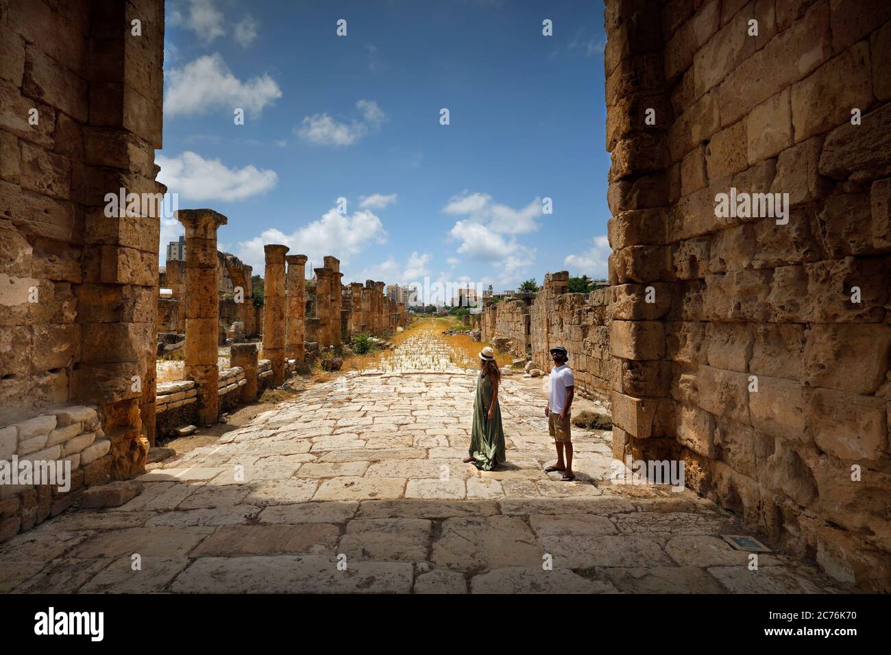 Active Couple with Pleasure Visiting Ruins of Tyre. Enjoying Majestic Ancient Architecture. Spending Romantic Vacation in Lebanon. Stock Photo