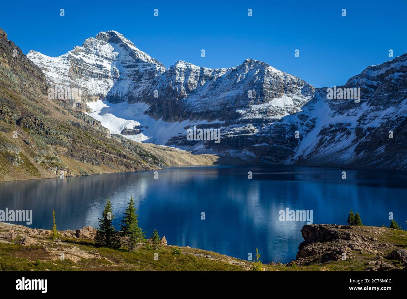 Canadian Rockies landscape of a blue lake surrounded by mountains with snow during autumn, Lake McArthur, Yoho National Park, British Columbia, Canada Stock Photo