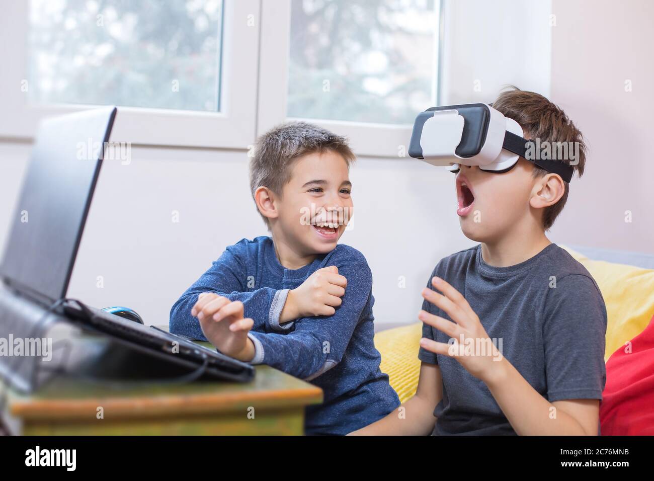 two young boys playing games on computer Stock Photo