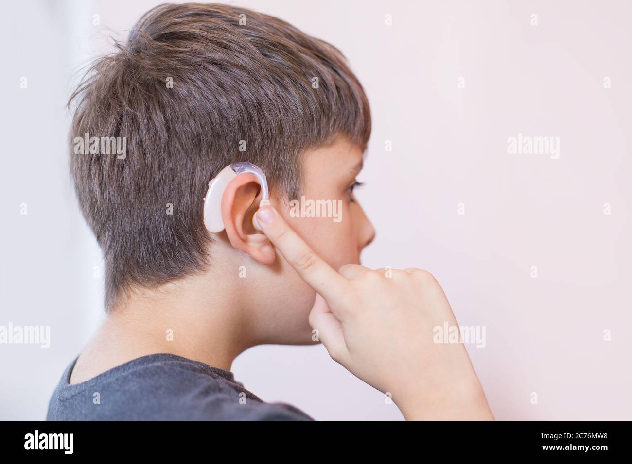young boy with hearing aid Stock Photo