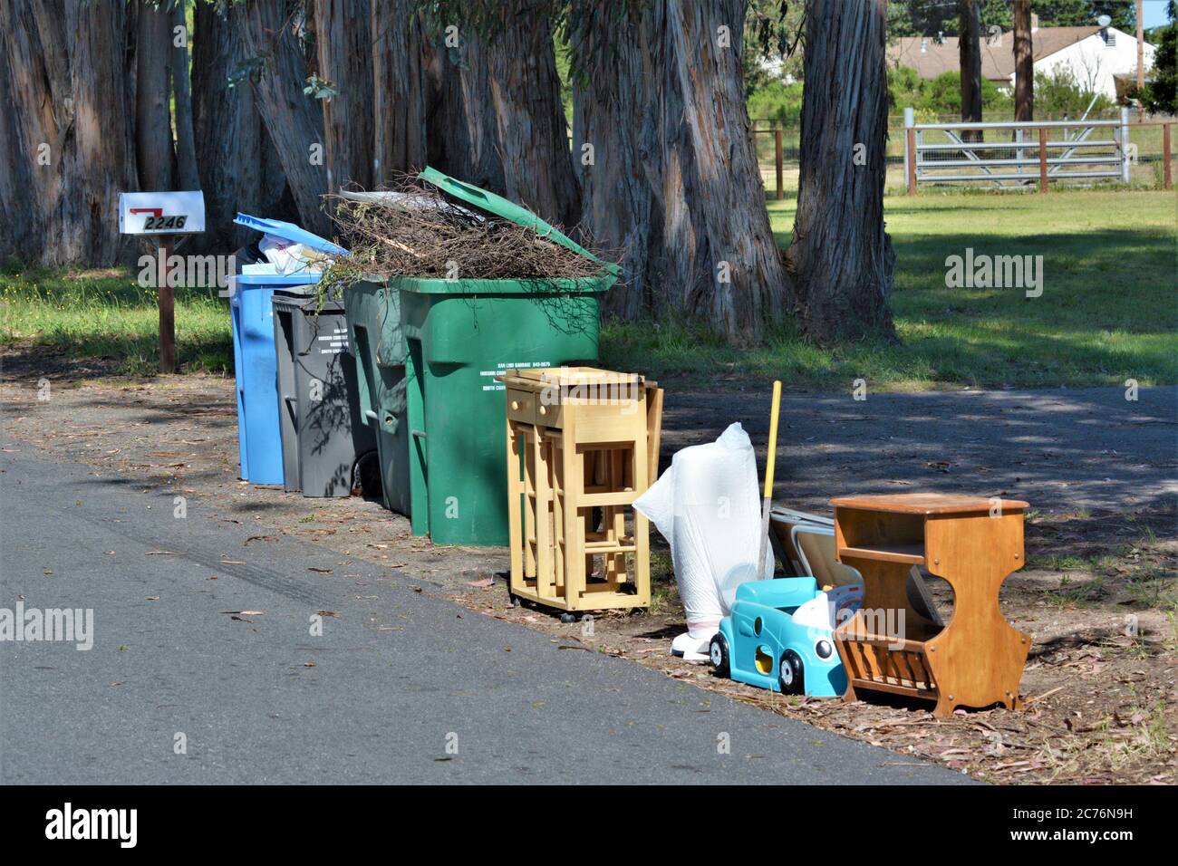 Trash pickup day with treasures from a home in California Stock Photo