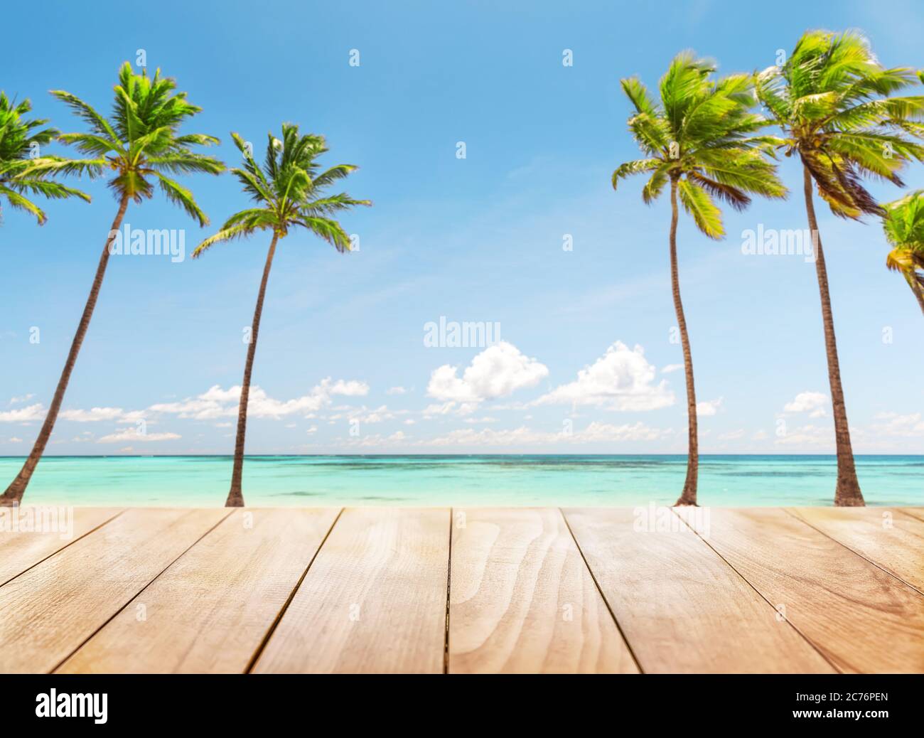 Wooden table top on blue sea and white sand beach background Stock