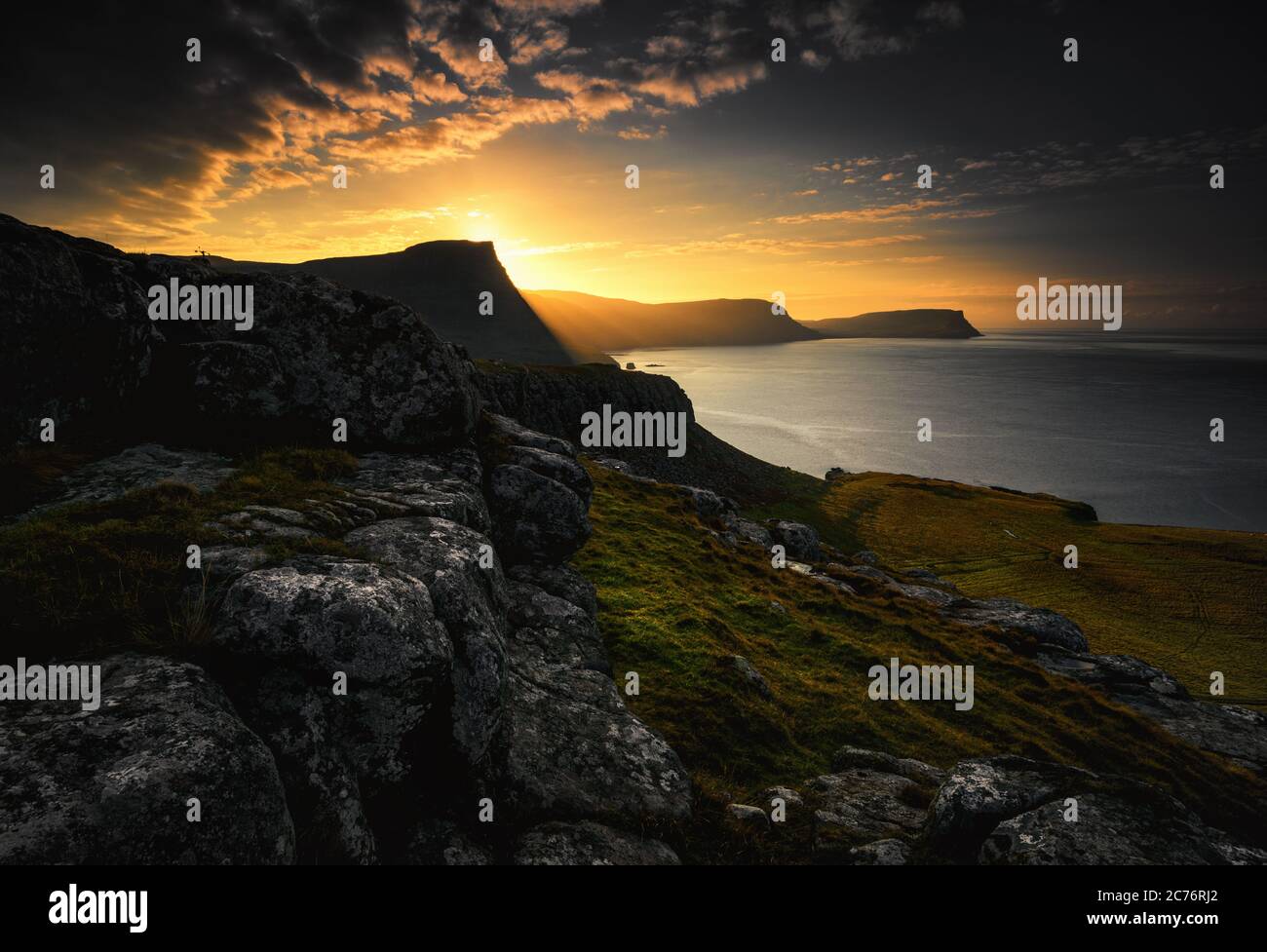 Coastal sunrise over Isle of Skye, Inner Hebrides, Scotland, UK Stock Photo