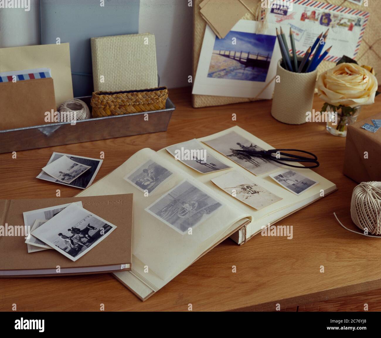 Photograph album open on desk Stock Photo Alamy