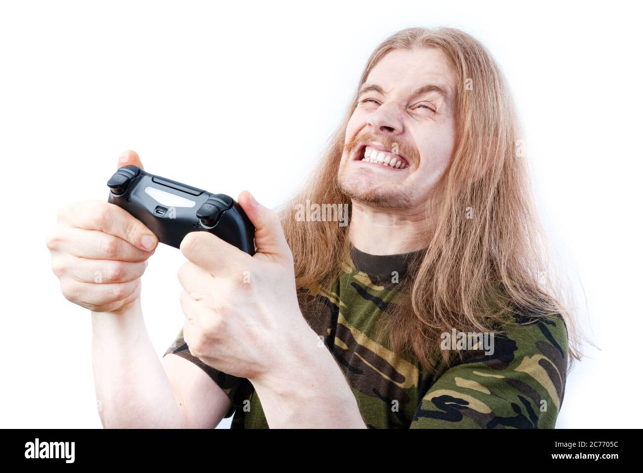 Frustrated Long Haired Gamer Clutching Video Game Controller Stock