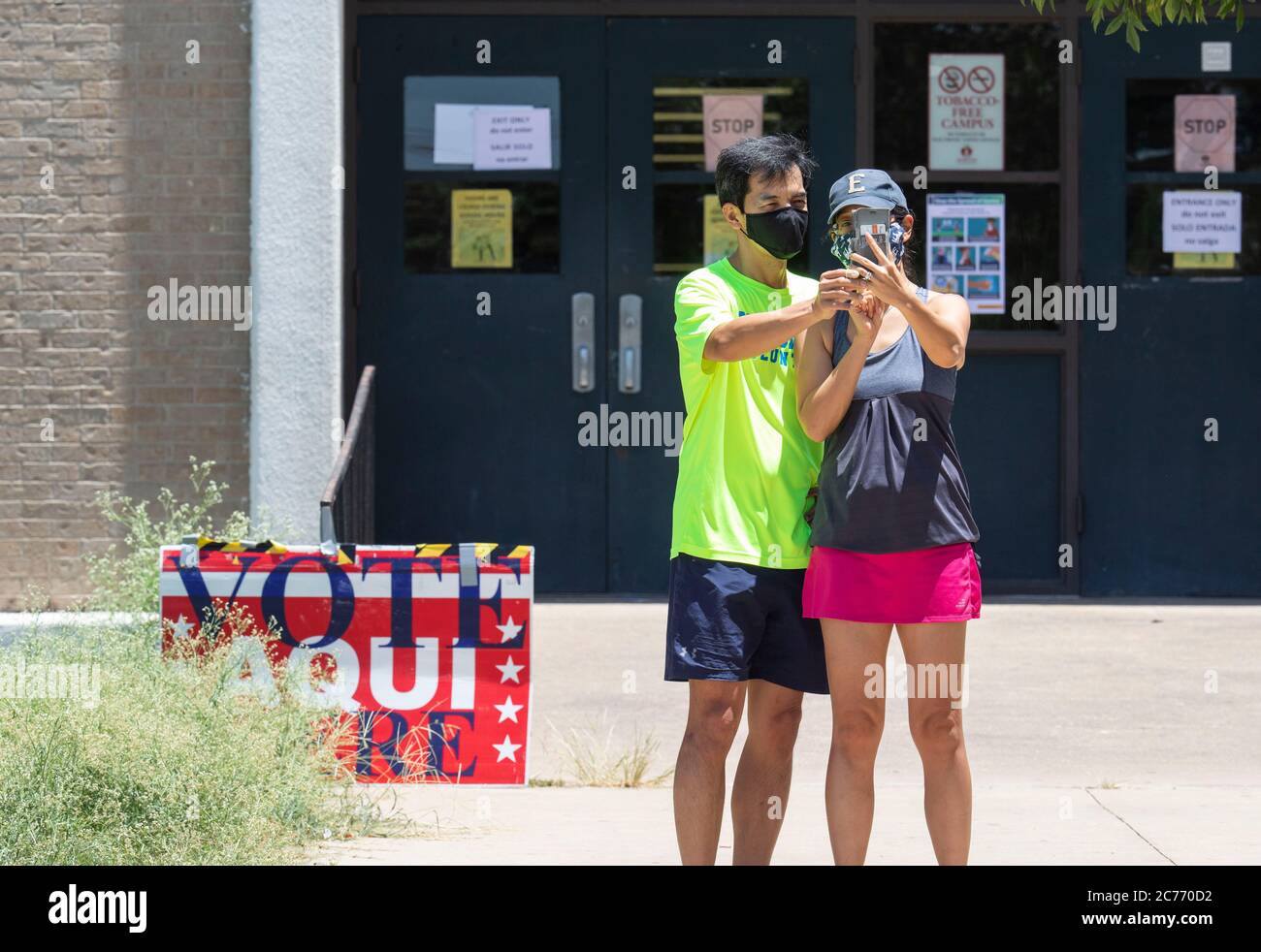 Austin, Texas, USA. 14th July, 2020. Masked voter take a selfie after exiting a polling place in south Austin Texas to vote in a primary runoff election determining match-ups for the November general elections. Although heavy by runoff standards, in-person voting is expected to still be less than 10% of registered Texans. Credit: Bob Daemmrich/ZUMA Wire/Alamy Live News Stock Photo