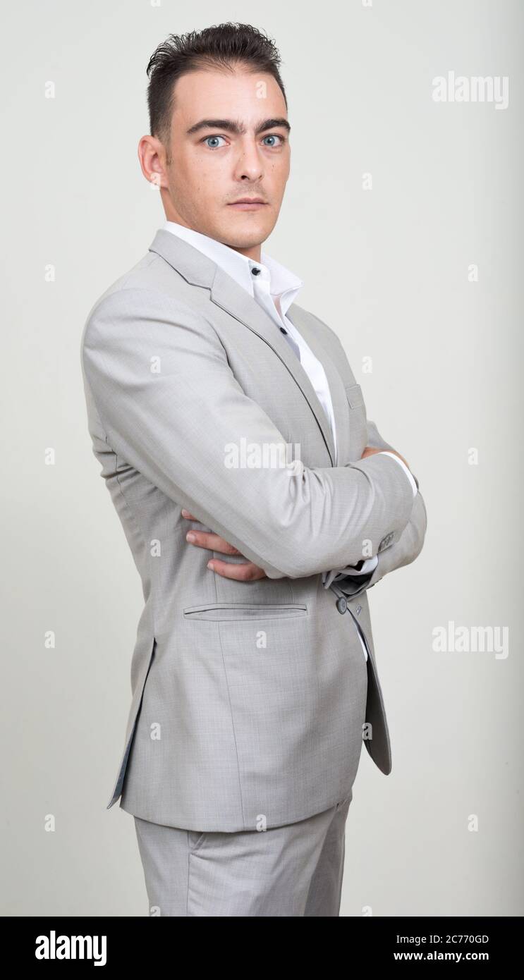 Portrait of young handsome businessman wearing suit Stock Photo - Alamy