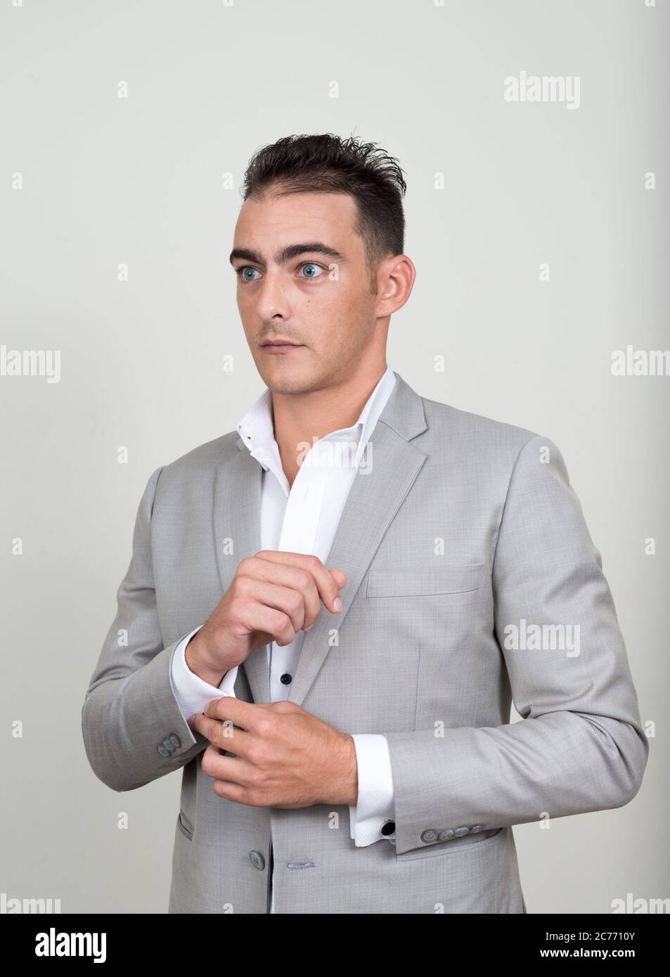 Portrait of young handsome businessman wearing suit Stock Photo - Alamy