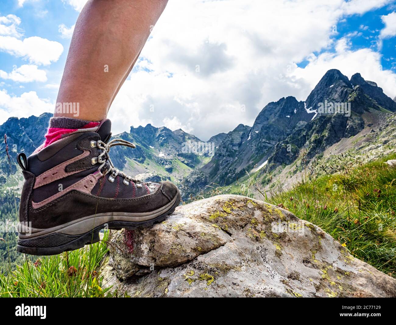 Trekking boot with the alps in background Stock Photo - Alamy