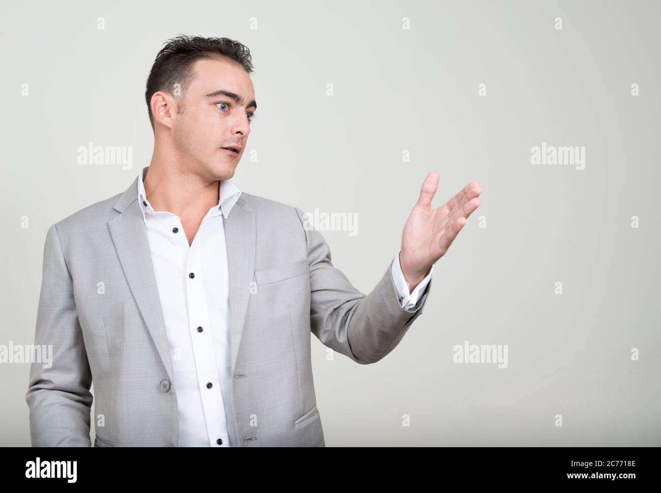 Portrait of young handsome businessman wearing suit Stock Photo - Alamy