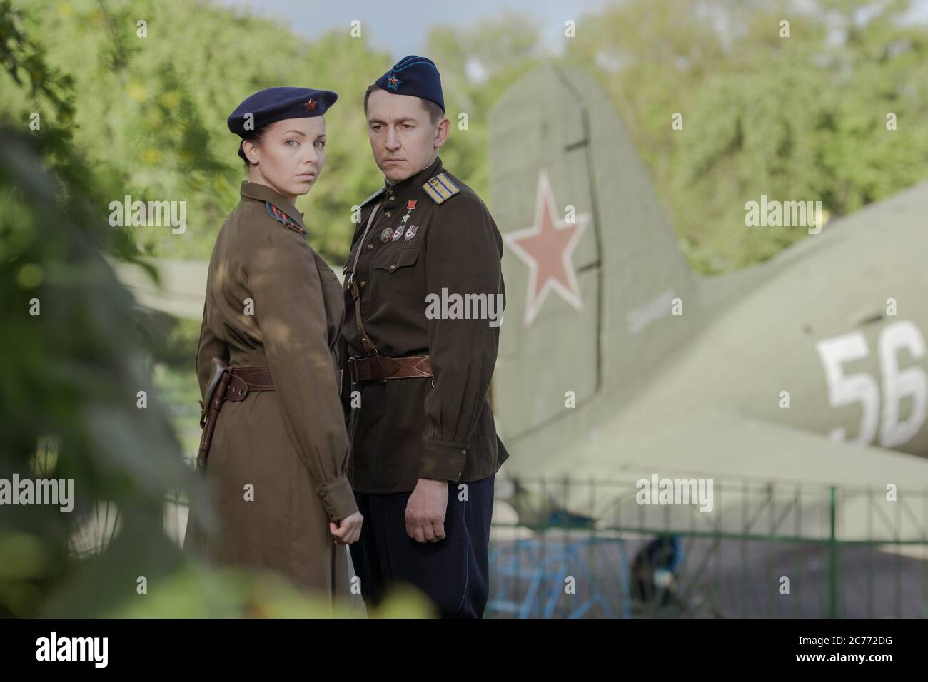 Young adult man and woman in the uniform of pilots of the Soviet Army of  the period of World War II. Military uniform with shoulder straps of a  major Stock Photo -