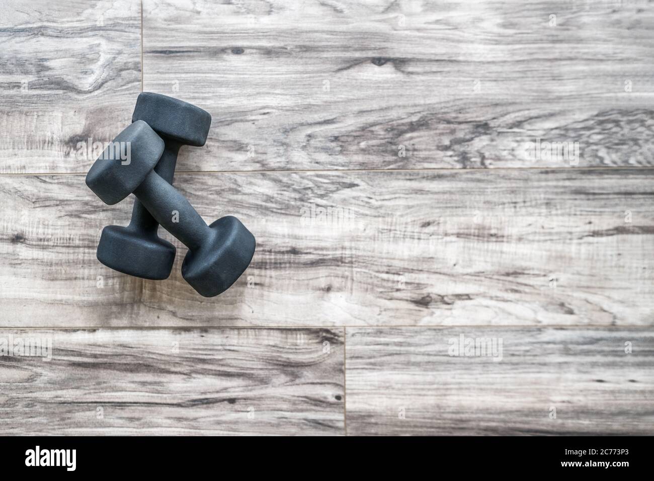Gym fitness strength training exercise dumbbell free weights top view  wooden background with copy space. Active weight loss lifestyle. Home  workout Stock Photo - Alamy