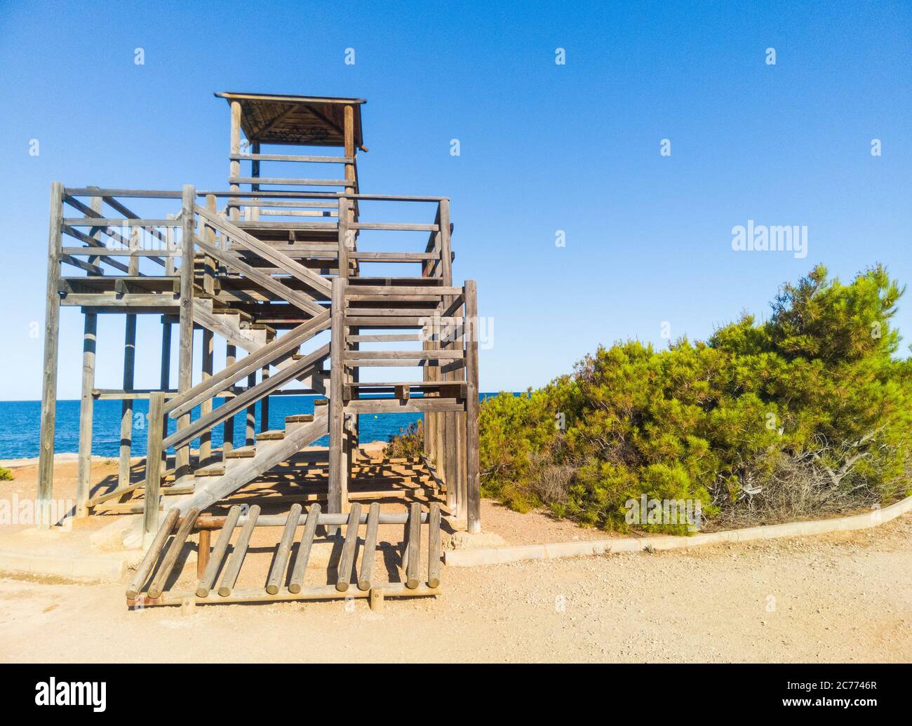Wooden tower, Alcossebre, Valencian community, Spain. Beautiful viewing point of the Costa del Azahar sea coast. Sunny summer day near Playa del Moro. Stock Photo